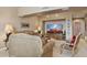 Inviting living room with neutral tones, comfortable seating, and a large television at 15755 E Palomino Blvd, Fountain Hills, AZ 85268