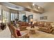 Inviting living room featuring comfortable seating, neutral colors, and bright natural light from large windows at 15755 E Palomino Blvd, Fountain Hills, AZ 85268