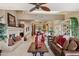 Open living room with fireplace flows into kitchen and dining areas at 15755 E Palomino Blvd, Fountain Hills, AZ 85268