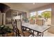 Covered outdoor dining area with a metal table and four chairs offering serene backyard views at 15755 E Palomino Blvd, Fountain Hills, AZ 85268