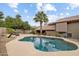 Serene backyard with a sparkling pool and lush landscaping offering a private retreat at 15755 E Palomino Blvd, Fountain Hills, AZ 85268