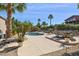 Backyard pool area with outdoor seating, mature landscaping and a privacy fence at 15755 E Palomino Blvd, Fountain Hills, AZ 85268