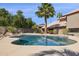Inviting backyard pool with ample space and lush landscaping creates a private oasis at 15755 E Palomino Blvd, Fountain Hills, AZ 85268