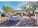 Outdoor barbecue area featuring a built-in grill, counter space, and shaded seating at 16292 N Naegel Dr, Surprise, AZ 85374
