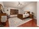 Serene bedroom with natural light, wood floors and ample space for relaxation and rest at 16292 N Naegel Dr, Surprise, AZ 85374
