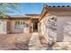 Inviting home featuring desert landscaping, tile roof, and a private entrance at 16292 N Naegel Dr, Surprise, AZ 85374