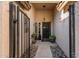 Charming front porch with a gated entry, plants, and a welcome sign at 16292 N Naegel Dr, Surprise, AZ 85374