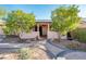 Charming single-story home with a landscaped front yard and a welcoming covered porch at 16292 N Naegel Dr, Surprise, AZ 85374