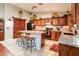 Spacious kitchen featuring an island with seating, granite countertops, and ample cabinet space for storage at 16292 N Naegel Dr, Surprise, AZ 85374