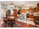 Charming kitchen with an island, bar seating, and dining table perfect for casual meals and entertaining at 16292 N Naegel Dr, Surprise, AZ 85374