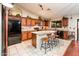 Bright kitchen with a central island, modern appliances, and ample counter space ideal for cooking and meal preparation at 16292 N Naegel Dr, Surprise, AZ 85374
