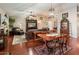 Open-concept living area with hardwood floors, comfortable furniture, and natural light creating a warm atmosphere at 16292 N Naegel Dr, Surprise, AZ 85374