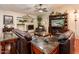 Comfortable living room with leather sofas, fireplace, and stylish decor creating a cozy ambiance at 16292 N Naegel Dr, Surprise, AZ 85374