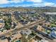 A neighborhood aerial view showcasing a residential area with houses and tree-lined streets at 17234 N Paradise Park Dr, Phoenix, AZ 85032