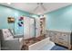 Light-filled bedroom with ample closet space, a cozy chair, and stylish decor for a relaxing ambiance at 17234 N Paradise Park Dr, Phoenix, AZ 85032