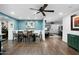 Inviting dining room showcasing a long table, chairs, and warm lighting that creates a cozy atmosphere at 17234 N Paradise Park Dr, Phoenix, AZ 85032