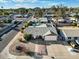 An aerial shot showcases the home's facade, two-car garage, minimal landscaping, and surrounding neighborhood at 17234 N Paradise Park Dr, Phoenix, AZ 85032