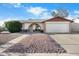 Charming single-Gathering home featuring a two-car garage and low maintenance desert landscaping at 17234 N Paradise Park Dr, Phoenix, AZ 85032