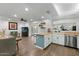 Open concept kitchen with stainless steel appliances, wood countertops, and seamless flow into the living area at 17234 N Paradise Park Dr, Phoenix, AZ 85032
