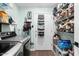 Well-organized laundry room with washer, dryer, and storage shelving for cleaning and laundry supplies at 17234 N Paradise Park Dr, Phoenix, AZ 85032