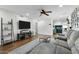 Open-concept living room with TV and comfortable seating at 17234 N Paradise Park Dr, Phoenix, AZ 85032