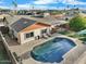 Aerial view of backyard pool with patio area and a partially covered outdoor living space at 17234 N Paradise Park Dr, Phoenix, AZ 85032