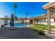 Expansive backyard with a modern lounge area, lush landscaping, and a clean aesthetic, perfect for outdoor living at 1949 E Oxford Dr, Tempe, AZ 85283