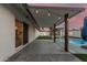Outdoor patio with modern pavilion overlooking inviting swimming pool and green artificial turf at 1949 E Oxford Dr, Tempe, AZ 85283