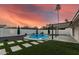 Resort style pool with artificial turf and desert landscaping, perfect for outdoor living at 1949 E Oxford Dr, Tempe, AZ 85283