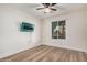 Cozy bedroom features laminate floors, ceiling fan and a bright window, perfect for relaxation at 1949 E Oxford Dr, Tempe, AZ 85283