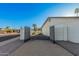 Private driveway with secure gate leading to a spacious property with manicured landscaping at 1949 E Oxford Dr, Tempe, AZ 85283