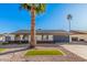 Charming single-story home with a well-manicured yard, desert landscaping, and modern garage door at 1949 E Oxford Dr, Tempe, AZ 85283