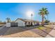 Beautiful single-story home with desert landscaping, arched entryway, and gated entrance at 1949 E Oxford Dr, Tempe, AZ 85283