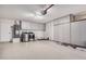 Well-organized garage features built-in cabinets and modern epoxy flooring for storage at 1949 E Oxford Dr, Tempe, AZ 85283
