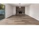 Spacious living room featuring a brick fireplace and modern lighting fixture at 1949 E Oxford Dr, Tempe, AZ 85283