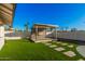 Modern backyard lounge area, framed by manicured landscaping, perfect for relaxing and entertaining guests at 1949 E Oxford Dr, Tempe, AZ 85283