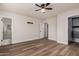Spacious main bedroom featuring a ceiling fan, walk-in closet, and an en-suite bathroom at 1949 E Oxford Dr, Tempe, AZ 85283