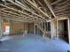 Unfinished basement under construction with staircase, exposed framing, and unfinished ceilings at 1970 W Lariat Ln, Phoenix, AZ 85085