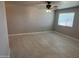 Bright bedroom features tile flooring, neutral walls, and a window for natural light at 2010 N 38Th Ave, Phoenix, AZ 85009