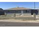 Charming single-story home with a low-walled yard, showcasing a neat and inviting facade under a clear sky at 2010 N 38Th Ave, Phoenix, AZ 85009