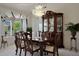 Dining room features a large cabinet, chandelier, and a dining table at 20416 N Palm Canyon Dr, Surprise, AZ 85374