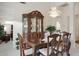 Dining room features a large cabinet, chandelier, and a dining table at 20416 N Palm Canyon Dr, Surprise, AZ 85374