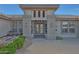 A beautiful front entrance with double glass doors and desert landscaping at 20416 N Palm Canyon Dr, Surprise, AZ 85374