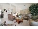A spacious living room decorated with classic furniture and a tree at 20416 N Palm Canyon Dr, Surprise, AZ 85374