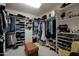 Organized walk-in closet featuring ample shelving, hanging space, and storage solutions for clothing and accessories at 20416 N Palm Canyon Dr, Surprise, AZ 85374