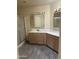 Bathroom featuring dual sinks and a tiled shower at 20625 N 104Th Ave, Peoria, AZ 85382