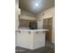 Eat-in kitchen featuring stainless steel refrigerator and bar seating at 20625 N 104Th Ave, Peoria, AZ 85382