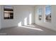 Bedroom featuring carpet and windows at 21422 W Meadowbrook Ave, Buckeye, AZ 85396