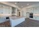 Bright kitchen with island, stainless steel appliances, and white cabinetry at 21422 W Meadowbrook Ave, Buckeye, AZ 85396
