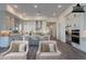 Staged kitchen with light quartz countertops, a stainless fridge, and stainless oven at 21422 W Meadowbrook Ave, Buckeye, AZ 85396
